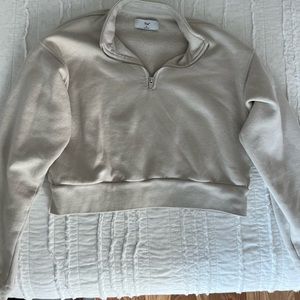tan/cream cropped quarter zip from aritzia